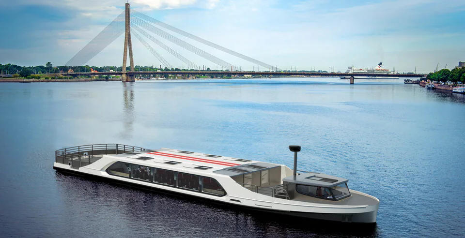 Ferri de pasajeros GYC 78 en aguas tranquilas junto a un puente