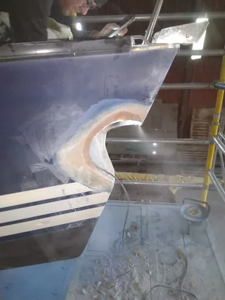 GRP bow repair area during surface preparation
