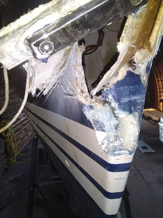 Damaged GRP bow before repair