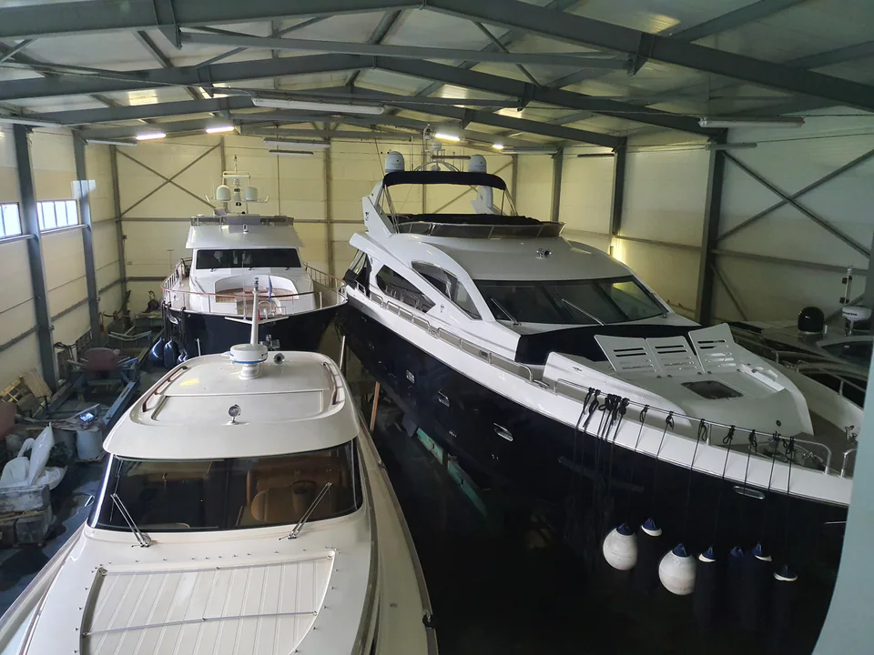 Sailing yacht supported ashore during maintenance work